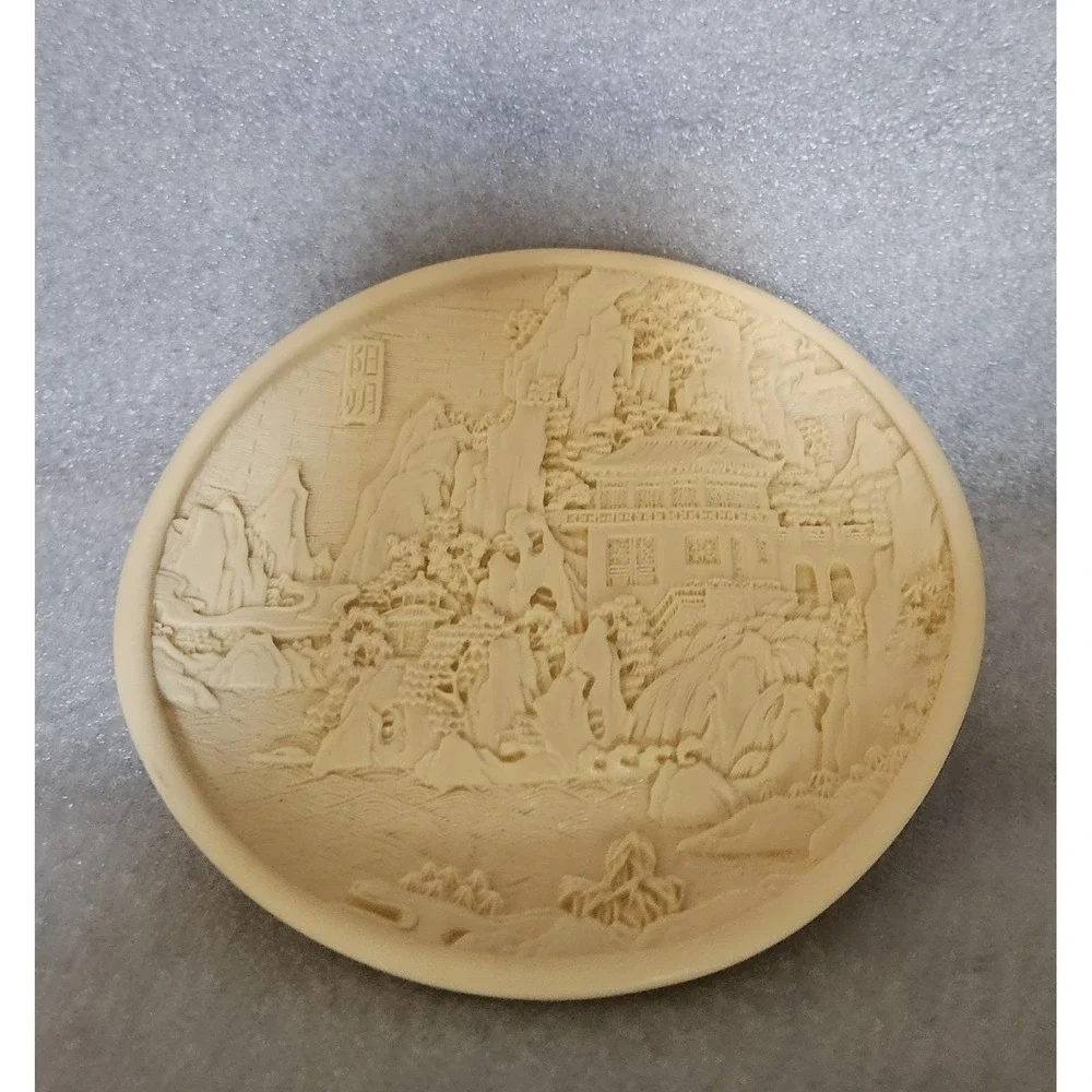 Vintage Chinese carved resin decorative plate with a landscape motif